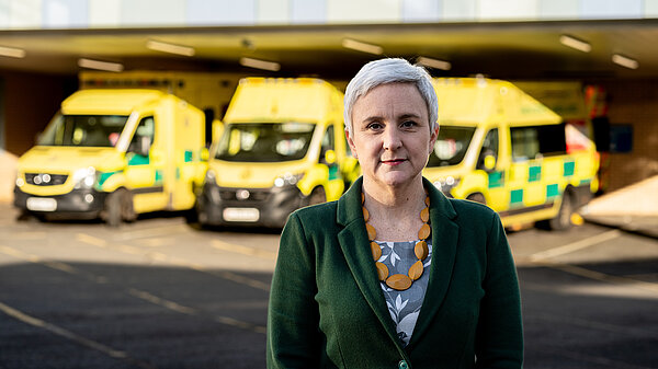 Alex in front of an ambulance bay.